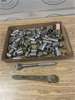 Socket wrenches and sockets