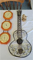 Barometer and guitar hanging
