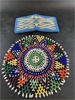 An intricately beaded coin purse and head covering