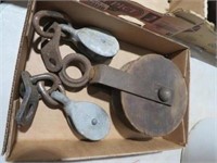 BOX OF OLD PULLEYS