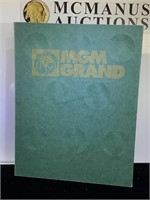 MGM Grand  8- $1 Gaming tokens w/Album