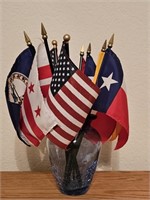 Variety of Small Flags in Glass Vase