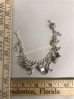 Sterling silver charm bracelet. Weight: 27.8 grams
