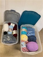 2 clear totes full of yarn.