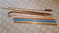 Pool Cues (2); Wood Cane, Yardsticks (5)