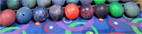 9 qty bowling balls on floor