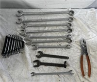 Various size, wrenches, and a pair of pliers