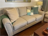 Tan/Beige Cloth Upholstered Sofa Couch with Toss