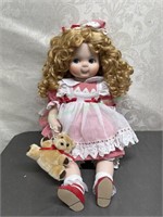 Porcelain doll in red gingham dress