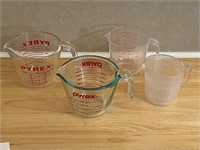2 glass Pyrex measuring cups 2 plastic