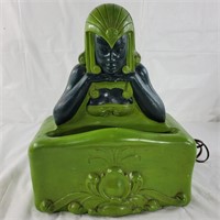 Green decorative Buddha lamp, turns on