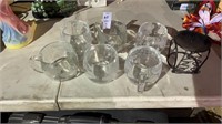 6 glass cups and candle holder