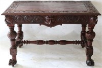LATE 19TH C. CARVED MAHOGANY LIBRARY TABLE W/
