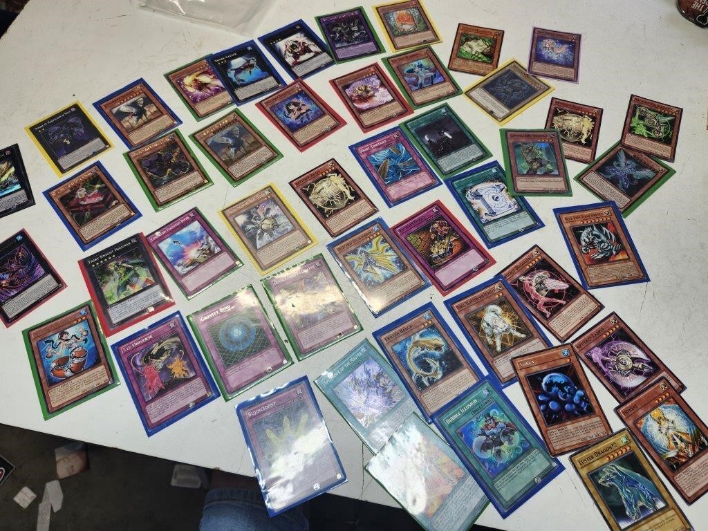 Collection of Yu-Gi-Oh cards.