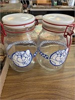 Two Pillsburry doughboy canisters