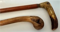 TWO GOOD WOODEN CANES ONE W CARVED HANDLE