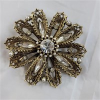 Gold in color floral broach