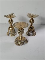 Three brass candle holders 7"h x 4.5"diam