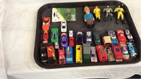 Collection of toy cars, trucks and action figures