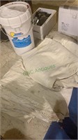 3 to 4 large used painting drop cloths, with a