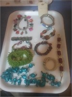 Tray of costume jewelry mostly bracelets