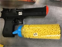 Plastic pellet gun with a bottle of plastic pellet
