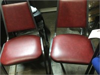 2 new dark red vinyl stack chairs