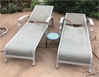 2 patio loungers with small table