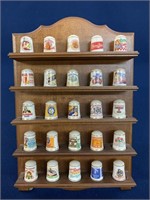 (25) Advertising thimbles and display shelf, one