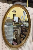 Beautiful gold gilded wooden frame oval mirror