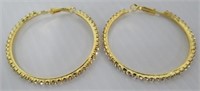 Women's large hoop earrings.