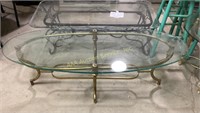 Glass top brass coffee table 18 inches x 56 x 24