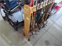 FIELD AND STREAM FISHING POLE STAND AND 14 POLES.