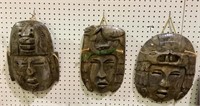 Lot of three carved marble Asian style masks wall