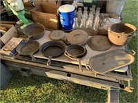 SEVERAL PIECES OF CAST IRON PANS