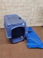 Large dog crate and tarp