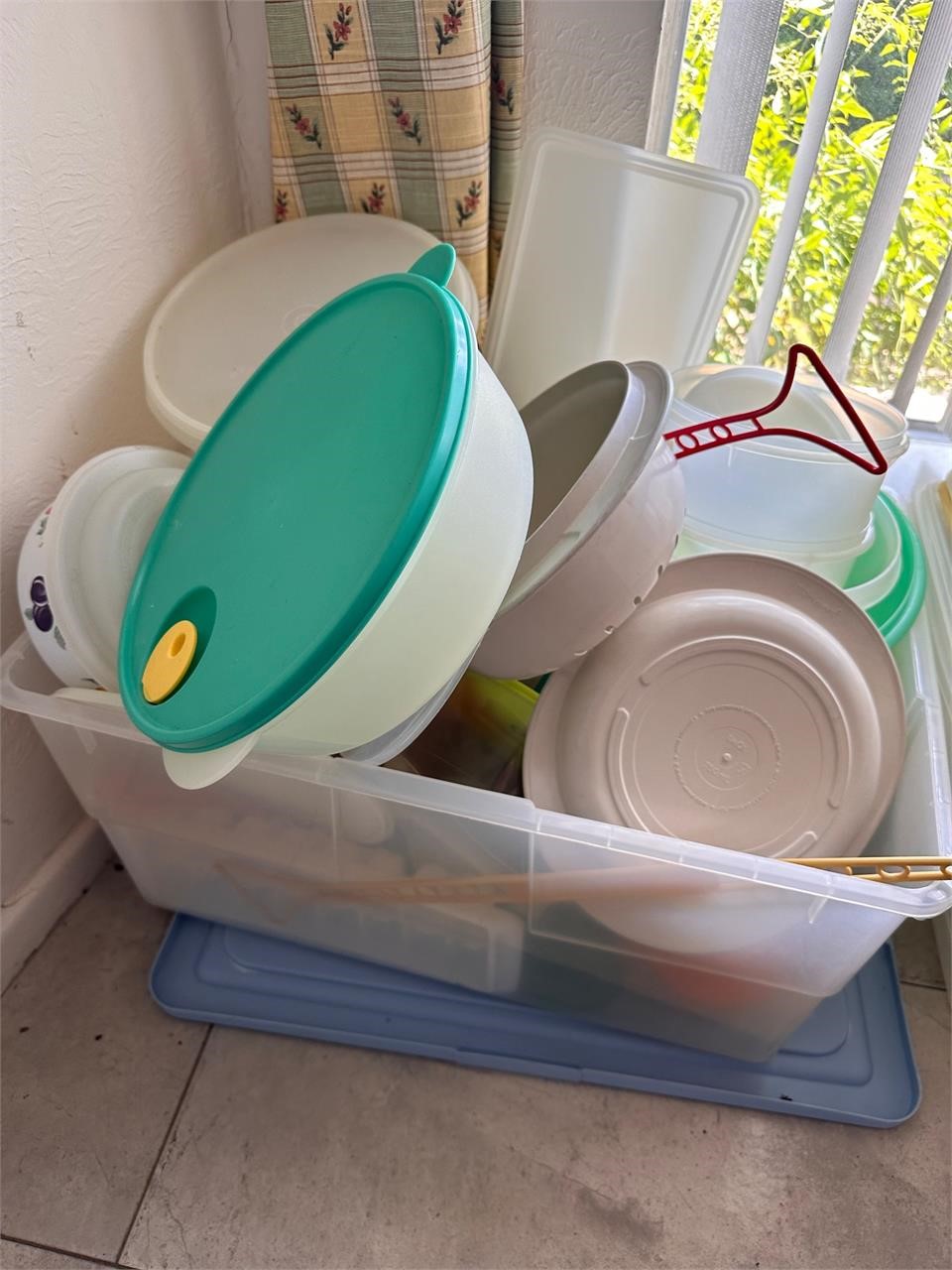 Tub full of Tupperware and other containers