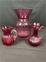 (3) pieces of cranberry  glass, vase is 8” tall