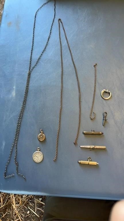Antique watch, winding keys, chains, and pendants