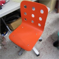 Orange desk chair.