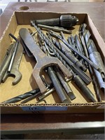 Box with drill bits, allen wrench, chuck