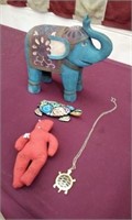 Voodoo doll, turtle, elephant