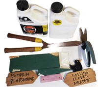 Various Lawn Care Equipment and Decorative Sign