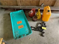 cart, gas cans, chain pieces