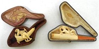 lot of 2 possibly hand carved pipes & cases