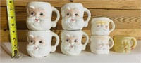 Vintage Santa Coffee Mugs w/ one plastic mug