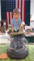 Plaster child statute with fishbowl
