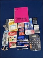 Assorted items including calculators, pens,