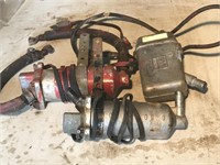 Trio of Vintage block heaters for a tractor. Two