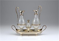 George III silver cruet stand with glass bottles
